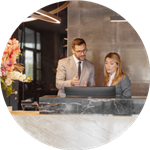 man and woman at hotel desk